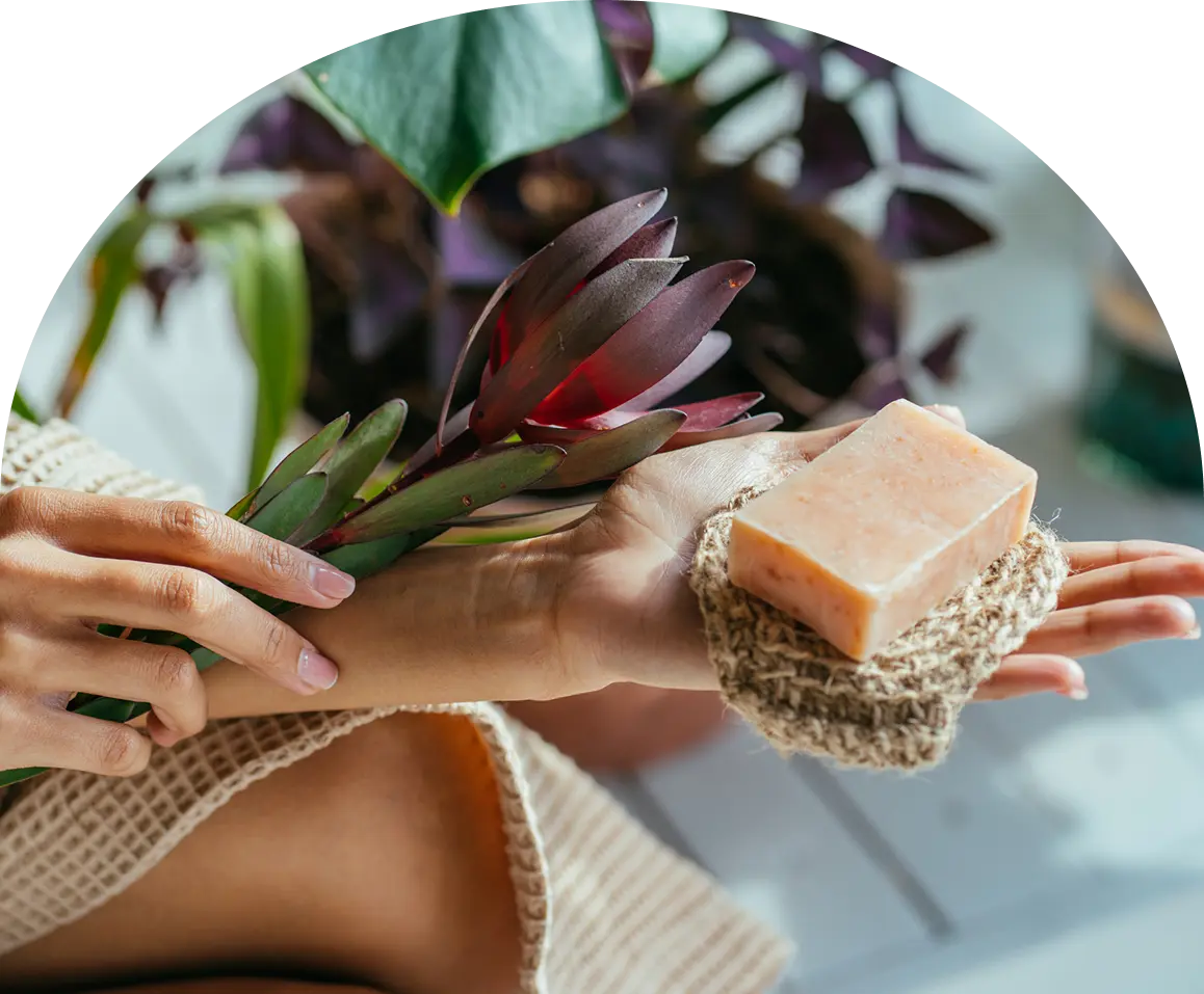 Person holding soap and foliage