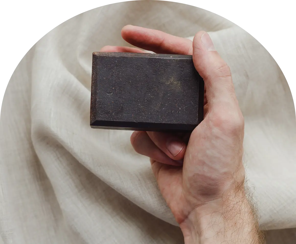 Hand holding a dark rectangular object