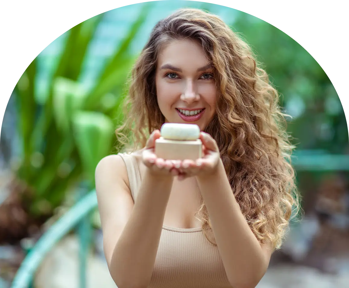Smiling woman presenting eco-friendly soap